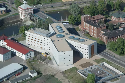 Before completion of the new building