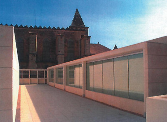 Terrace roof of the State Public Library in Palma de Mallorca, Spain. The church of Santa Creu on the background