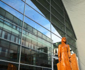 Side of building: Alberte, the wooden statue