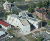 Before completion of the new building